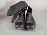 a pair of shoes with a hat on top of them