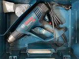 a blue box with a black and silver electric tool in it
