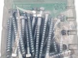 many screws in a plastic container on a white surface