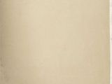 an old piece of paper with torn edges on a wooden surface