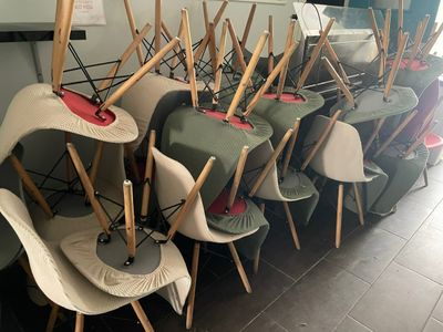 many chairs and umbrellas lined up in a row