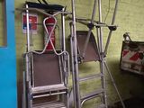two ladders that are next to each other in a room