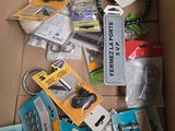 a cardboard box filled with assorted items and a keychain