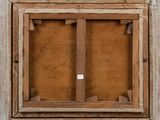 an old wooden window frame with a small square window in the middle