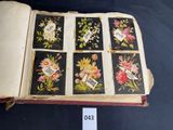 an open book with pictures of flowers on it