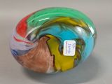 a colorful glass ball with a tag on it