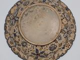 a plate that has a blue and white design on it