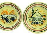 two yellow plates with blue and red designs on them on a white surface