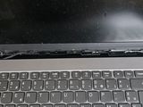a laptop that has a broken keyboard on it