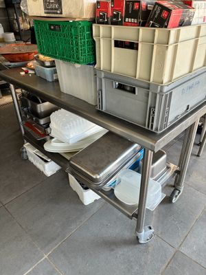 a metal table with a bunch of boxes on top of it