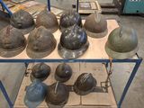 many helmets sitting on a cart in a warehouse