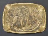 an image of a gold plate with an image of a lion on it