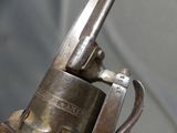 a close up of a gun that is on display