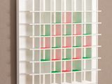 a white book shelf with many shelves on it