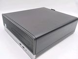 an image of a small black computer on a white surface