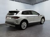the rear end of a silver car parked in a garage