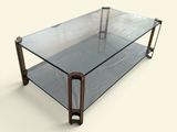 une table basse en verre avec des pieds en métal et un plateau en verre