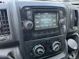a radio in the dash of a car with a clock on it
