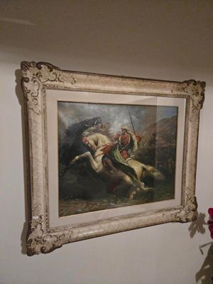 un tableau représentant un homme à cheval à côté d'un vase de fleurs