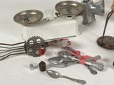 many different types of kitchen utensils on the table