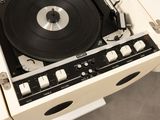 a record player that is sitting on top of a table