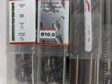 many different types of drill bits in a plastic case