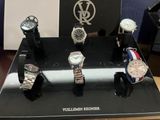 several watches are on display in a display case on a table