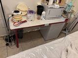 a table with a microwave and a blender on it