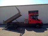 a red truck that is parked in front of a building