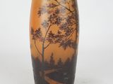 a vase that has a picture of a tree on it
