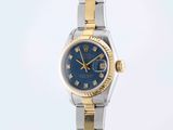 an image of a lady ' s wrist watch with a blue dial