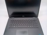 the dell laptop is open and ready to be used