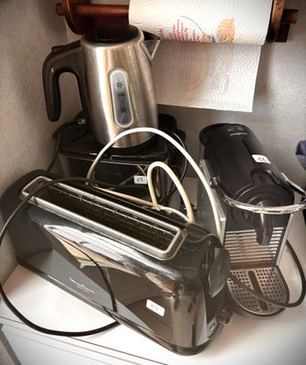 a toaster and a toaster sitting on a kitchen counter