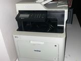 a printer that is sitting on top of a desk