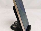 a cell phone that is on a stand on the table