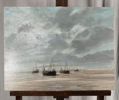 un tableau posé sur un chevalet représentant des bateaux sur l'eau