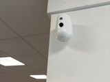 an image of a camera mounted on the wall of a building