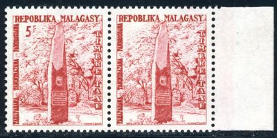a close up of a stamp with a picture of trees on it