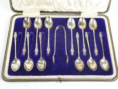 silver plated spoons and spoons in a case with velvet lining