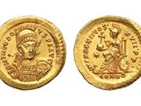 a gold coin with an image of a man on it