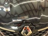 a close up of a car ' s front grill with a sticker on it