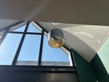 a light that is hanging from the ceiling in the room