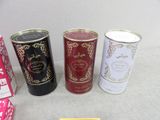 several tins of tea are lined up on a table