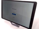 a tablet computer that is sitting on top of a stand