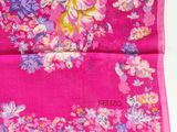 pink silk scarf with a floral design on the front of it