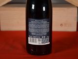 a bottle of wine that is sitting on a table