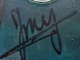 a close up of a parking meter with graffiti on it