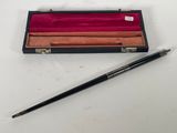an image of a pen and a pen case on a table