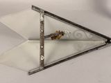 a pair of scissors that are laying on top of a piece of glass