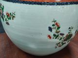a large bowl sitting on top of a wooden table